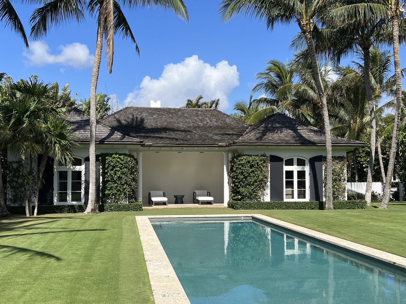 Pool deck and rear patio, painted residence